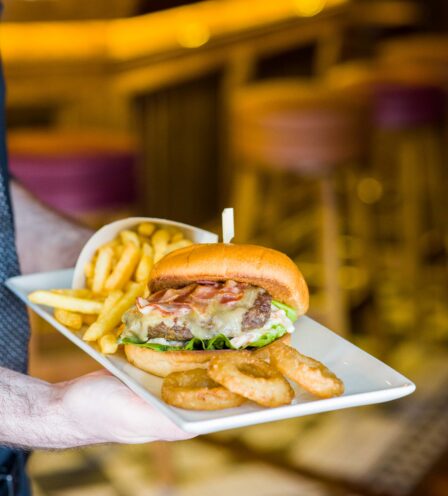 Delicious burger with chips and onion rings served at Scotts Hotel Killarney bar.