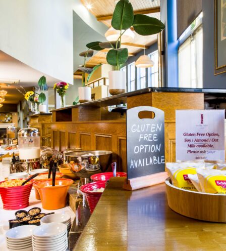 Buffet breakfast with gluten-free options at Scotts Hotel Killarney, featuring fresh pastries and cereals.