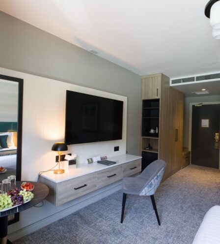 Modern hotel room at Scotts Hotel Killarney with cosy bed, elegant decor, and a welcoming atmosphere.