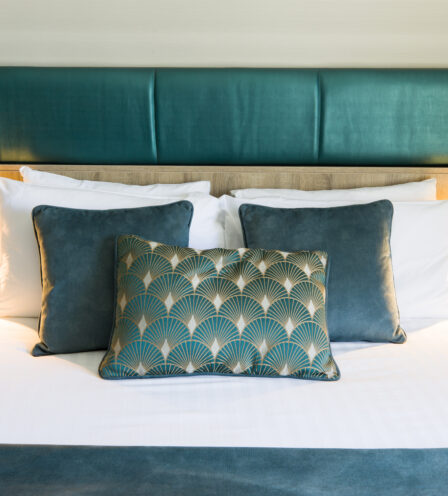 Elegant hotel room with plush pillows and soft lighting at Scotts Hotel Killarney.