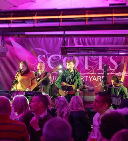 Band performing lively music for an engaged audience at Scotts Hotel Killarney bar.