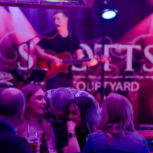 Guests enjoy live music in Scotts Hotel Killarney's vibrant courtyard setting.