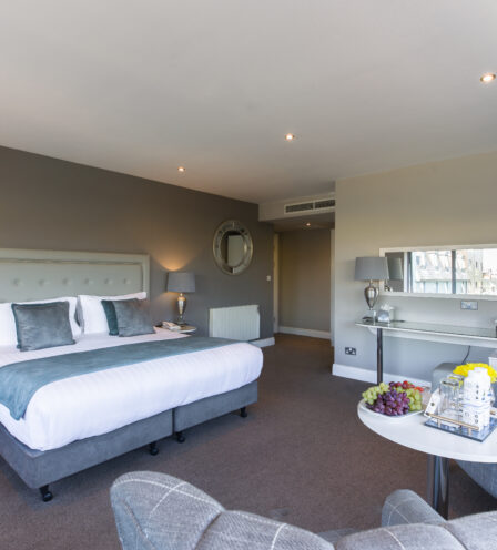 Modern hotel room at Scotts Hotel Killarney with cosy seating and elegant decor.