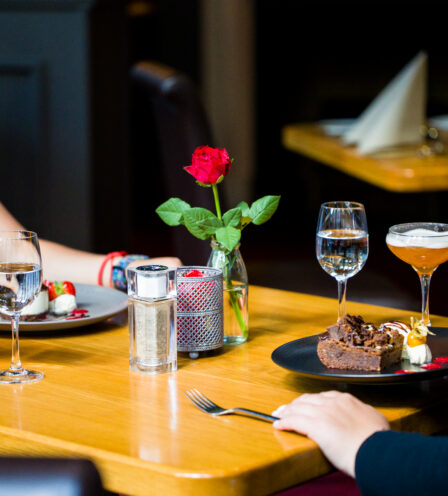 Guests enjoy dessert and cocktails at a cosy table in Scotts Hotel Killarney restaurant.