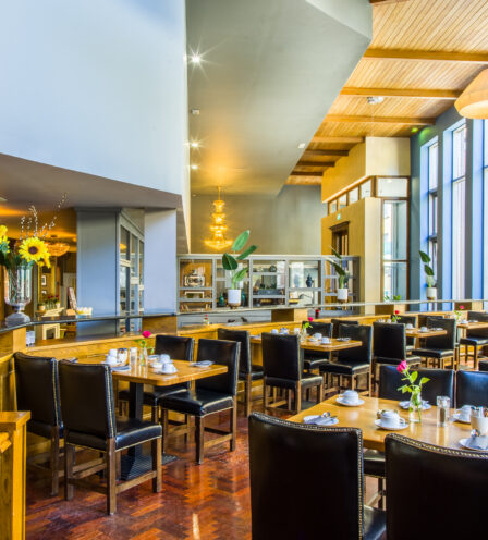 Bright and inviting dining area at Scotts Hotel Killarney with set tables and elegant décor.