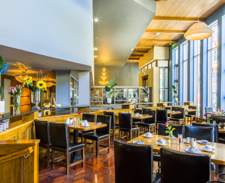 Bright and inviting dining area at Scotts Hotel Killarney with set tables and elegant décor.