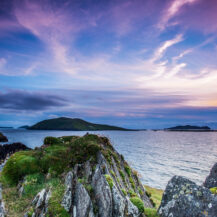 Scenic coastal view at sunset with vibrant skies near Scotts Hotel Killarney.