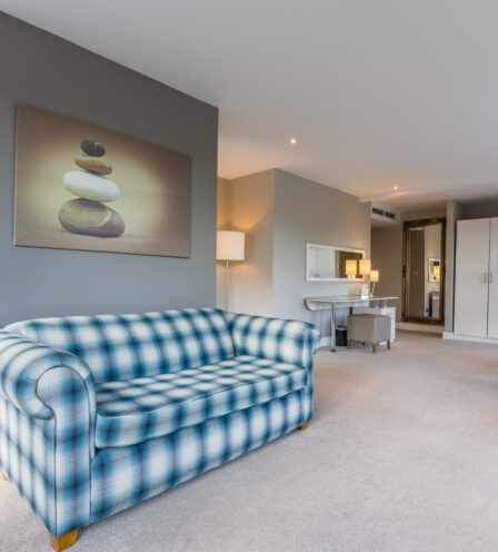 Spacious hotel suite with comfortable seating and modern decor at Scotts Hotel Killarney.
