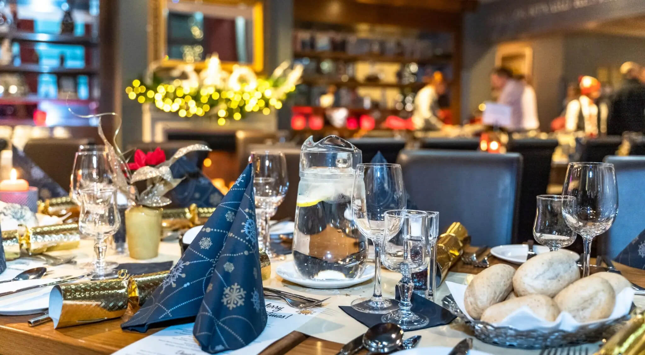 Festive dinner setting at Scotts Hotel with elegantly decorated tables and diners enjoying the evening.