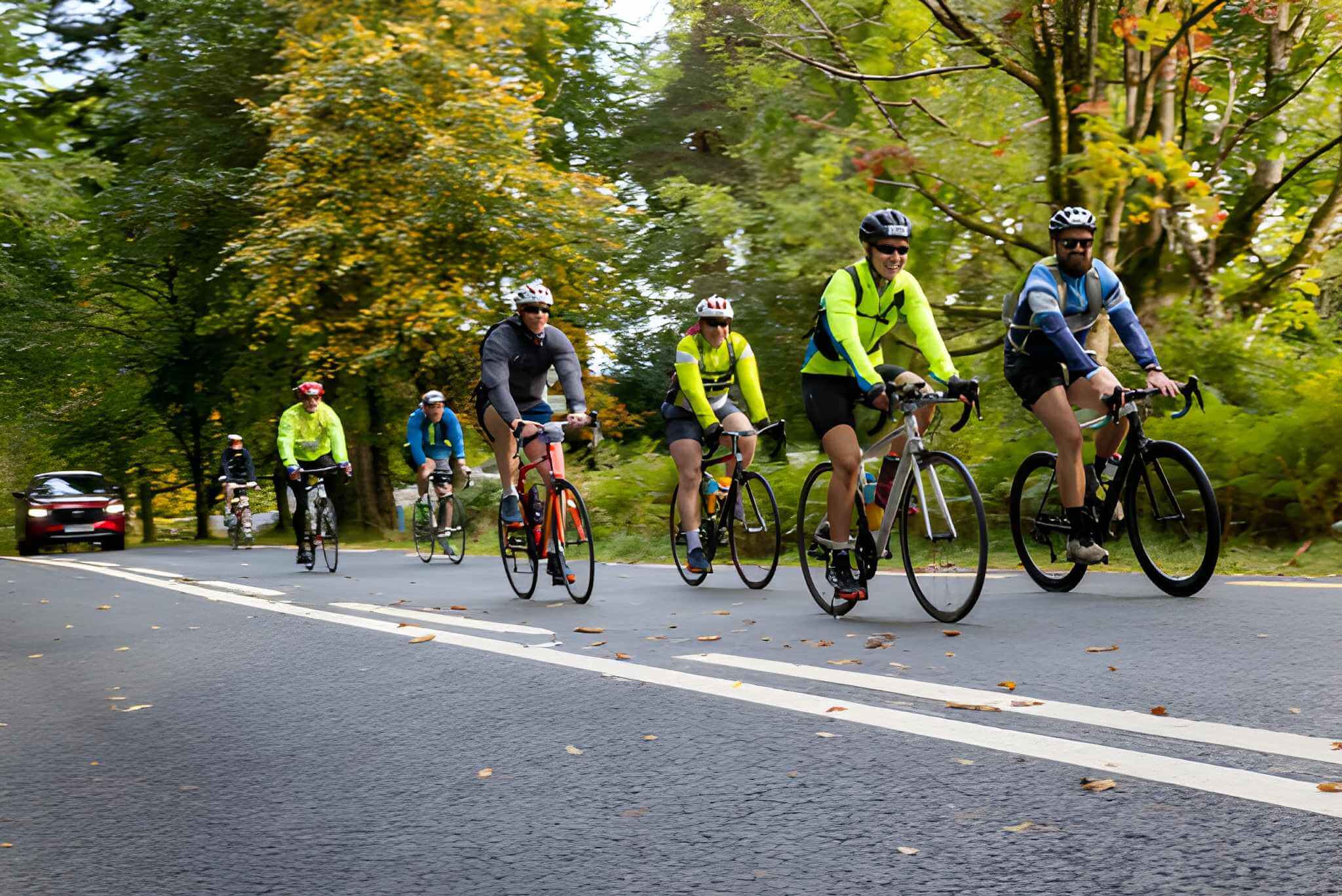 Cyclists enjoying a scenic ride through lush, autumnal landscape near Killarney.