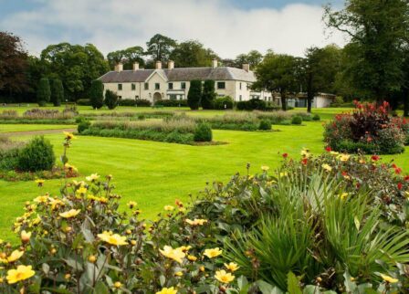 Lush gardens at Scotts Hotel Killarney on a sunny day.