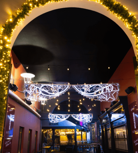 Festive entrance at Scotts Hotel Killarney with illuminated arch and elegant décor.