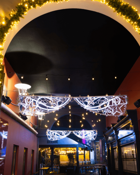Festive entrance at Scotts Hotel Killarney with illuminated arch and elegant décor.