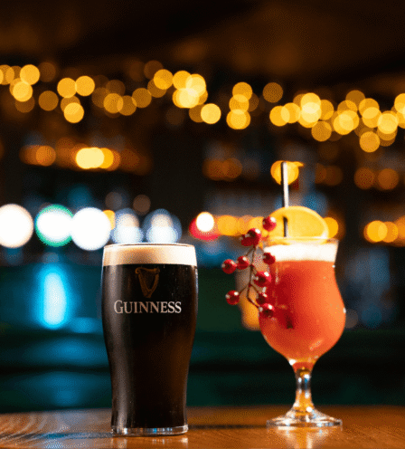 Two drinks on a cosy bar table with warm lighting at Scotts Hotel Killarney.
