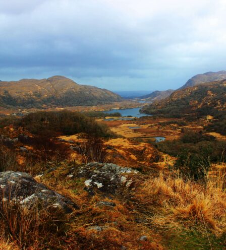 Scenic view of lush hills and a serene lake near Scotts Hotel Killarney.